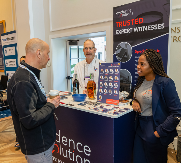 Exhibitors Interacting with Attendee